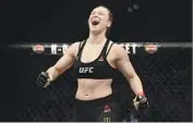  ?? Harry How Getty Images ?? RONDA ROUSEY celebrates her 2015 victory over Cat Zingano in their UFC fight at Staples Center.