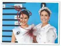  ??  ?? GEELONG milliner Rebecca Share took out top honours for the accessory that sets race wear apart from the rest at Oaks Day.The local designer (right) was awarded the Myer Milinery Award for her modern red piece modelled by Danielle Collis (left).Collis paired the standout head wear with a simple, white Elliatt dress to let it be the feature.