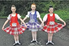  ??  ?? Christina Crawford, Katie Aird and Leah Goodbrand from Baird/Livingston were highland dancing at Atlantis Leisure Centre.