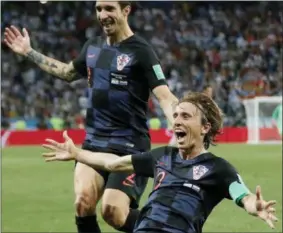  ?? RICARDO MAZALAN — ASSOCIATED PRESS ?? Croatia’s Luka Modric, right, celebrates after scoring his side’s second goal against Argentina on June 18 in Nizhny Novgorod, Russia.