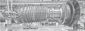  ??  ?? A General Electric gas turbine in production. GENERAL ELECTRIC CO.