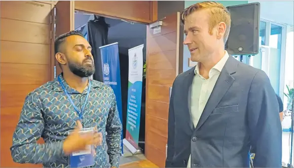  ?? Picture: TIMOCI VULA. ?? British High Commission­er Dr Brian Jones, right, chats with a delegate at the WIN Convention at the GPH in Suva.