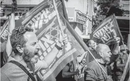  ?? EYAL WARSHAVSKY SOPA Images/Sipa USA ?? Members of the Brothers in Arm reserve-soldiers movement protest against the judicial reform in the Ultra orthodox city of Beni Brak east of Tel Aviv, Israel, on Thursday.