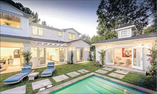  ?? Photograph­s by Todd Goodman LA Light Photog r aphy ?? PRICED AT $ 2, 999,950, the newly built home with 5,420 square feet of living space features a backyard swimming pool with spa that leads to a guesthouse.