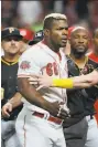  ?? John Minchillo / Associated Press ?? Yasiel Puig got in a brawl for the Reds just after being dealt to Cleveland.