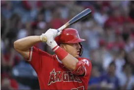  ?? MARK J. TERRILL - THE ASSOCIATED PRESS ?? FILE - In this July 25, 2019, file photo, Los Angeles Angels’ Mike Trout bats during the first inning of the team’s baseball game against the Baltimore Orioles in Anaheim, Calif. Sixty-five players would earn at least $100,000 each time their team wins or loses if the pandemic-delayed major league season get under way, according to an analysis of their contracts by The Associated Press. Trout’s salary works out to $222,222 for each game of the 162-game season.