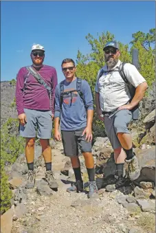  ??  ?? From left, hikers Brendan Besetzny, Jakub Coziuk and James Downing from Colorado head down the Cebolla Mesa Trail.