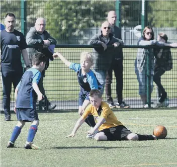  ??  ?? Russell Foster action at Castle View Academy. Washington AFC Wildcats u9’s (blue) v Hedworth Whites u9’s (gold).
