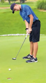  ?? GREG SORBER/JOURNAL ?? Alex Moores, a sophomore-to-be at Cottonwood Classical Prep, gets in some putting practice Tuesday at Tanoan Country Club.