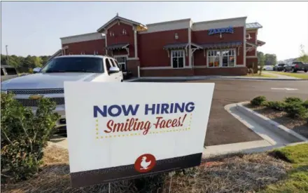  ?? ROGELIO V. SOLIS — THE ASSOCIATED PRESS ?? This help wanted sign is posted at a new Zaxby’s restaurant in Madison, Miss. On Friday, Sept. 7, the Labor Department reported on job openings and labor turnover for August.