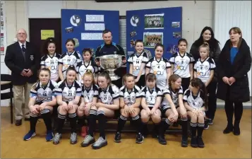  ??  ?? Fergal Ógs players with the Sam Maguire.