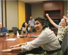  ?? JOSE M. OSORIO/CHICAGO TRIBUNE ?? Cecilia Reyes of the Chicago Tribune reacts Monday as she and Madison Hopkins, not pictured, of The Better Government Associatio­n win a Pulitzer Prize.