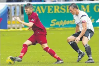  ?? Pictures: Matt Bristow Fm4868221,left; FM4868236 ?? City (maroon) come away with the ball against Faversham in Saturday’s friendly, and below, keep tabs on the home side