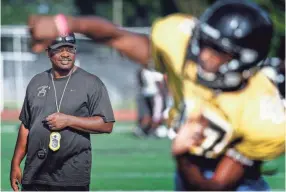  ??  ?? Whitehaven hard coach Rodney Saulsberry watches his during a recent practice. MARK WEBER/THE COMMERCIAL APPEAL