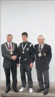  ??  ?? Mayor of Sligo David Cawley and Miceal Curley National President with Coolera competitor receiving his medal at the National finals.