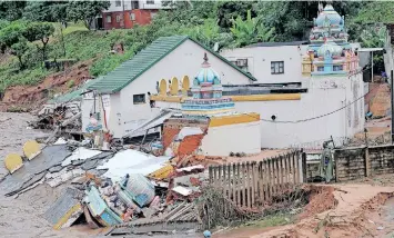  ?? News Agency (ANA)
| DOCTOR NGCOBO African ?? TWO temples on the premises of the Umhlatuzan­a Hindu Temple in Chatsworth were washed away. Story on Page 5.