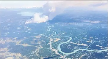  ?? Alaska Division of Forestr y ?? A WILDFIRE on the Kenai Peninsula south of Anchorage. A second and larger blaze, the Sockeye fire, rages north of the city. “It’s been hot and dry, and there was a low snow year. That all leads to fires,” a resident said.