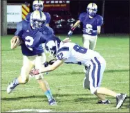  ?? Photo by Mike Eckels ?? Decatur’s Cayden Bingham (2) tries to slip past a Rebel tackler during the Oct. 13 homecoming contest between the Bulldogs and JC Westside in Decatur. By Mike Eckels meckels@nwadg.com