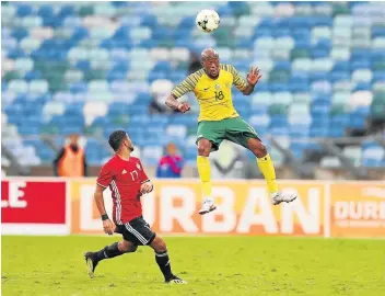  ?? Picture: GALLO IMAGES/Anesh Debiky ?? ALL UP IN THE AIR: Bafana Bafana’s Sifiso Hlanti heads the ball away during the 2019 Africa Cup of Nations qualifying match against Libya at the Moses Mabhida Stadium in Durban on Saturday.The match ended in a 0-0 draw.