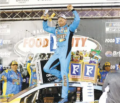  ?? WADE PAYNE/AP ?? Kyle Busch celebrates after surprising­ly winning a NASCAR Cup Series race on dirt in Bristol, Tennessee.