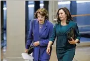  ?? BILL CLARK CQ Roll Call ?? CALIFORNIA’S U. S. Sens. Dianne Feinstein and Kamala Harris walk toward the Senate chamber.