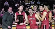  ?? MIKE CAPSHAW/ ENTERPRISE-LEADER ?? Matt Thomas and his Farmington teammates celebrate their victory over longtime nemesis Alma on Dec. 30 during the Airedale Classic.