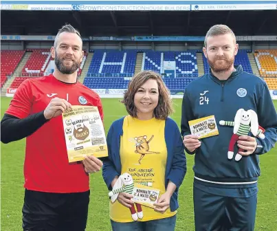  ?? Picture: Stuart Cowper. ?? St Johnstone players Alan Mannus and Brian Easton with Emma White, the ARCHIE Foundation head of fundraisin­g.