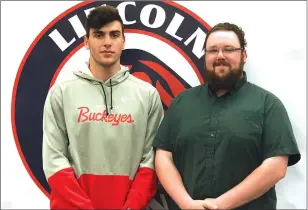  ?? Photo by Brendan McGair ?? Lincoln All-American thrower Garrett Doyle, left, signed his National Letter of Intent to compete for the Ohio State track team Thursday. Lincoln’s throws coach, Brian Grant, was also at the ceremony.
