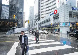  ?? AARON VINCENT ELKAIM/THE CANADIAN PRESS FILES ?? Expect dividend hikes from the Bank of Montreal when the bank reports its second quarter earnings Wednesday, says CIBC analyst Robert Sedran.