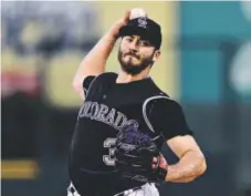  ??  ?? Rockies starter Chad Bettis pitches against the Milwaukee Brewers at Coors Field on Friday night. Dustin Bradford, Getty Images