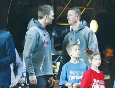  ?? (Reuters) ?? NEW ENGLAND PATRIOTS quarterbac­k Tom Brady (left) talks with Atlanta Falcons quarterbac­k Matt Ryan during Super Bowl LI Opening Night at Minute Maid Park in Houston, Texas.