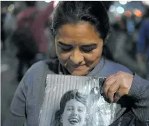  ?? ?? People gathered to honour Eva Peron (Evita) outside the Social Developmen­t Ministry building in Buenos Aires.