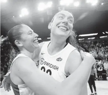  ?? ELAINE THOMPSON/ASSOCIATED PRESS ?? Seattle’s Breanna Stewart, right, celebrates with Sue Bird after the Storm defeated the Phoenix Mercury, 94-84, in Game 5 of a WNBA semifinals series Tuesday night. Bird has been a member of two WNBA championsh­ips teams, while Stewart is chasing her first.