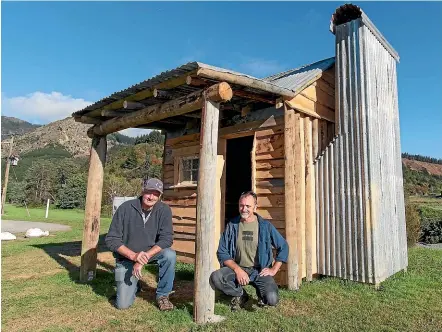  ?? HELEN NICKISSON/STUFF ?? A replica miner’s hut has recently been completed at Canvastown. Les Douglas, left, and Craig Dobie have worked on the constructi­on. The hut will serve as a tourist informatio­n centre for the town.