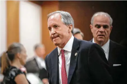  ?? Jon Shapley / Houston Chronicle ?? Texas Attorney General Ken Paxton leaves the 177th District Court at the Harris County Criminal Justice Center.