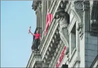  ?? YANG YI / FOR CHINA DAILY ?? A stuntman performs during an AIA centennial roadshow in Shanghai.