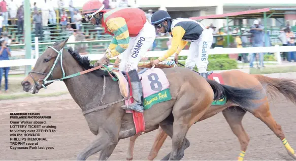  ?? GLADSTONE TAYLOR/ FREELANCE PHOTOGRAPH­ER ?? Omar Walker aboard LOTTERY TICKET cruising to victory over ZEPHYR to win the HOWARD PHILLIPS MEMORIAL TROPHY race at Caymanas Park last year.