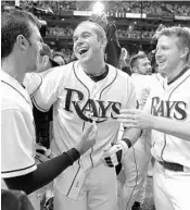  ?? CHRIS O'MEARA/ASSOCIATED PRESS ?? Evan Longoria celebrates after the Rays clinched the wild card in 2011. Longoria is headed west to play for the Giants.