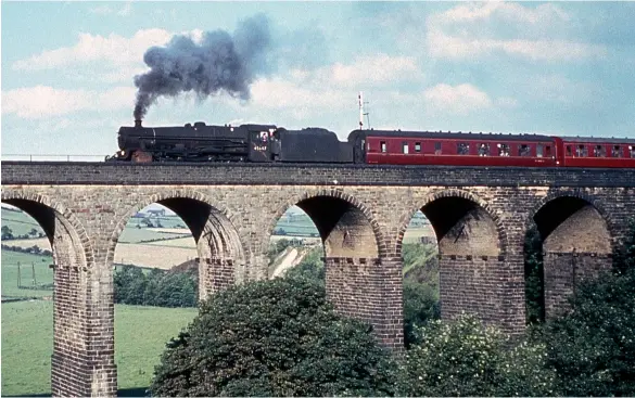  ?? D J Mitchell/Colour-Rail.com/BRM1738 ?? Farnley Junction-allocated ‘Jubilee’ No 45647 Sturdee forges out over Penistone viaduct with train 1N63, the 10.29 Poole to Bradford (Exchange) on Saturday, 2 July 1966. This is the return duty for the engine that was earlier employed on 1O43, the 09.06 Bradford (Exchange) to Poole and had taken over from a diesel at Nottingham (Midland). There was no Leeds portion in this direction but a connection was made with a trans-Pennine service at Huddersfie­ld instead. It was planned to use a ‘Jubilee’ again on this service in the summer of 1967 but in the end only the Bradford (Exchange) to Huddersfie­ld section was steam-worked, with the last reported use of steam being Fairburn ‘4MT’ No 42152 on 26 August 1967, several months after the last steam-worked inter-regional on the Southern.
