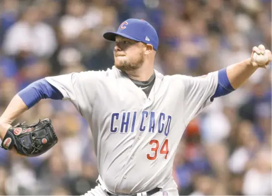  ?? TOM LYNN/ AP ?? Cubs starter Jon Lester scattered three hits and one walk over six innings against the Brewers to lower his ERA from 8.10 to 2.89. The lefty struck out six.