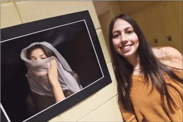  ?? Arnold Gold / Hearst Connecticu­t Media ?? North Haven High School senior Zoey LoPresti is pictured on Friday with a photograph she took as a sophomore of classmate, Aubrey Reyes, that won a Congressio­nal Art Award and hangs in the Capitol Building in Washington, D.C.