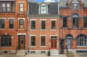  ?? ?? The row house at 2328 Sarah St. on the South Side was built in the early 1900s and has a slate roof.