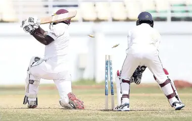  ?? CWI MEDIA/ATHELSTAN BELLAMY ?? West Indies ‘A’ batsman Jahmar Hamilton is bowled by Malinda Pushpakuma­ra on the second day of the second ‘Test’ between Windies ‘A’ and Sri Lanka ‘A’ at the Trelawny Multipurpo­se Complex yesterday.