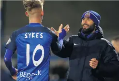  ??  ?? Magic Mark: Glenavon boss Gary Hamilton hails goalscorer Mark Sykes as Coleraine are put to the sword at Mourneview Park last night