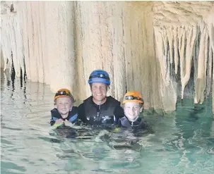  ??  ?? Sam Shank with his sons in Dominican Republic. He prefers to stay at the Playa Grande Beach Club. The surroundin­g area is very rugged.