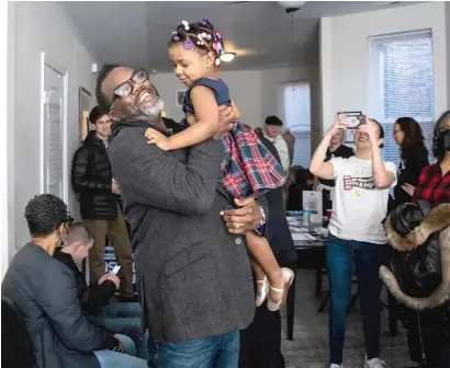  ?? ASHLEE REZIN/SUN-TIMES ?? Mayoral candidate Brandon Johnson greets supporters Sunday during a campaign house party in North Lawndale on the Southwest Side.