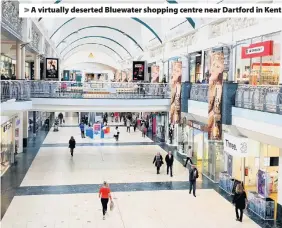  ??  ?? > A virtually deserted Bluewater shopping centre near Dartford in Kent