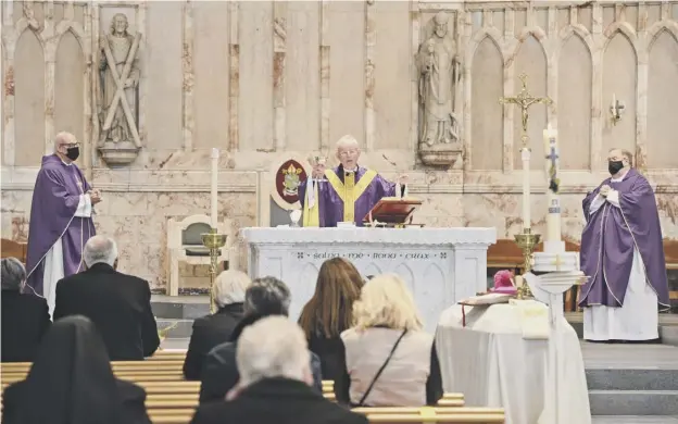 ??  ?? 0 The Funeral Mass for Most Reverend Philip Tartaglia, Archbishop of Glasgow, who died on January 13, 2021; below left, giving a homily in 2015