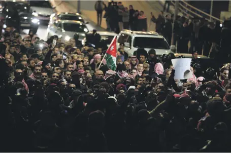  ?? AFP ?? Protesters in the Jordanian capital of Amman demonstrat­e on Thursday against the government’s decision to raise taxes