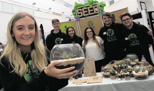  ??  ?? WINNERS: Young entreprene­urs from Inverurie Academy’s team SEED show off their products designed to reduce carbon dioxide emissions. Front, Megan Brown with, from left, Justin McLeod, Leanne Mercer, Erin Trail, Spencer O'Grady and Konrad Rossvoll-Booth